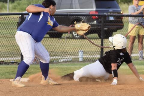 Alina Jones slides under the tag from the Moss player.
