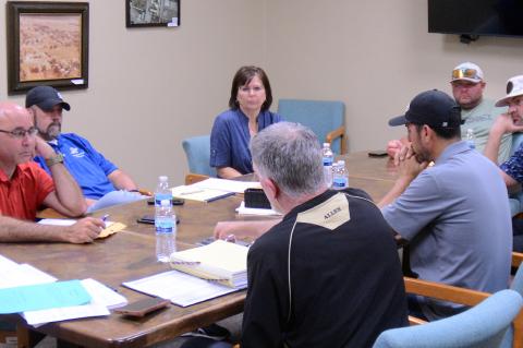 Retiring Allen Schools’ Superintendent Jeff Hiatt, foreground, speaks to the Allen Board of Education Monday at its regular meeting. The meeting was the last that Hiatt will attend as superintendent. Pictured clockwise from left are, Board President Fra