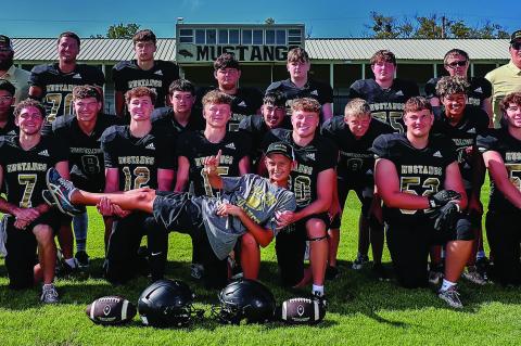 Manager Daigen Fisher shows what he thinks about the Mustangs! Front row Seniors (l-r) Ethan Smith, Davion Byrd, Kayd Bell, Quintin Box, Brayden Holliway, Noah Bray, Blake Campbell, Curt Carlos, Cash Robertson. Second row: Mario Gonzalez, Briar Heck, Laws