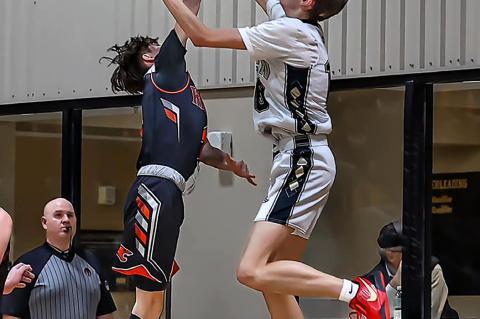 Grady Holder found himself with the hot hand scoring 23 points in the game. Photo by Loaded Lens Photography