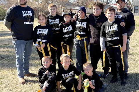 The Allen Outlaws brought home the gold ball in the Inaugural season of Flag Football in Allen. Pictured are Coach D’Ambrey Hubbard, Sophie Martin, Travis, Maddox Barfield, D’andre Hubbard, Jase Johnson,VanShires Kevin Martin, front Hudson Martin, Col