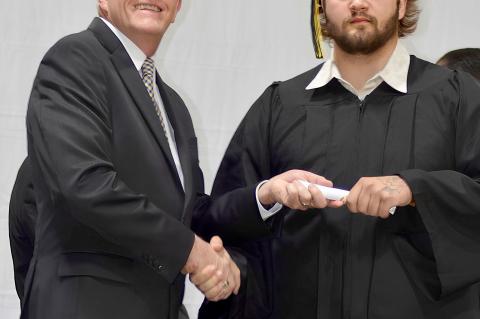 Michael Simpson gets his diploma from Sup. Hiatt