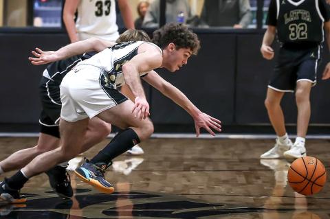 Kayd Bell battles for a loose ball in a recent game. Photos Courtesy Loaded Lens Photography