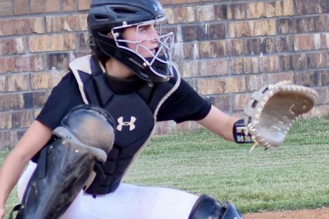 Kayla Nickell handles the catching duties for the Lady Mustangs.