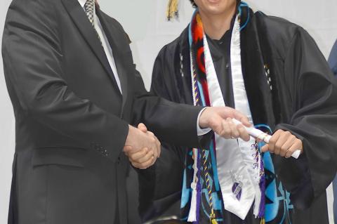 Brady Crabtree gets his diploma from Sup. Hiatt
