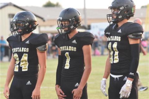 The three Allen captains for the Stratford game: Conner Smith, Brogen Goodson and Dillon Blessing.