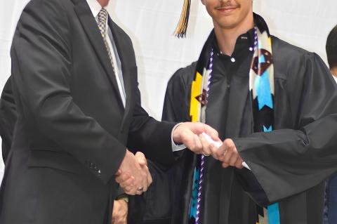 Justin Kerr receiving hisdiploma