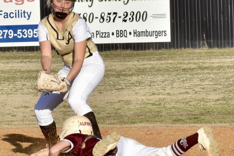 The Lady Mustangs began their slow pitch season on Tuesday hosting Coleman. Allen fell 11-0. Pictured is second baseman Khloe Goodson about the apply the tag. Schedule shows a trip to Milburn Thursdasy and a home game hosing Tupelo on Friday