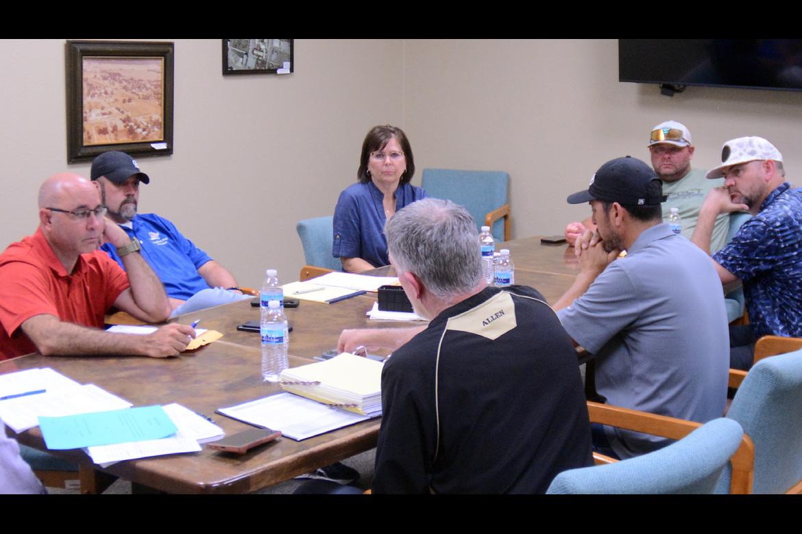 Retiring Allen Schools’ Superintendent Jeff Hiatt, foreground, speaks to the Allen Board of Education Monday at its regular meeting. The meeting was the last that Hiatt will attend as superintendent. Pictured clockwise from left are, Board President Fra